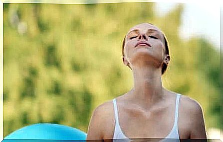 A woman doing breathing exercises.