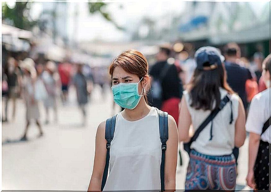 A supercontaminator wearing a mask to protect others